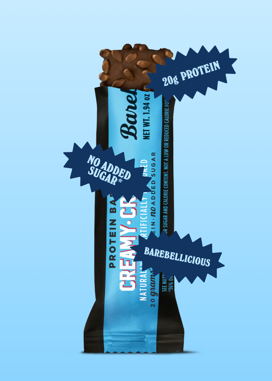 Barrita Barebells sabor creamy crisp anunciando que contiene 20g de proteína, sin azúcar añadida y sabor delicioso